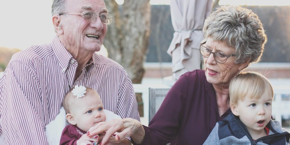 Grandparents sitting with Grandchildren