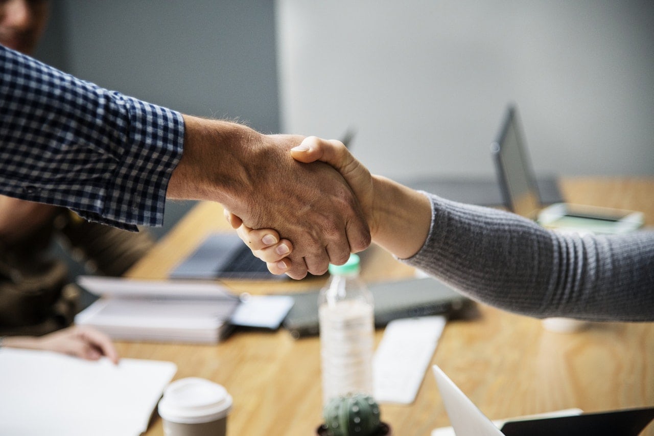 A man and woman shaking hands