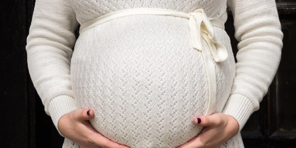 Child Support - pregnant woman Pregnant Woman holding her belly