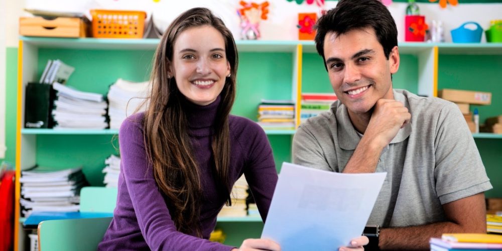 Young couple at parent teacher conference