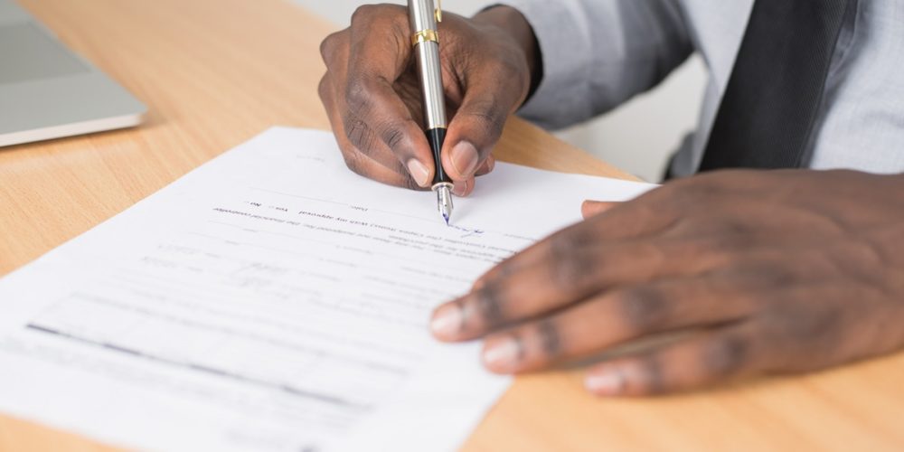 Man signing document