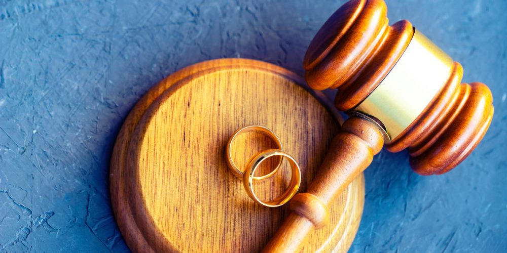 Gavel and wedding rings