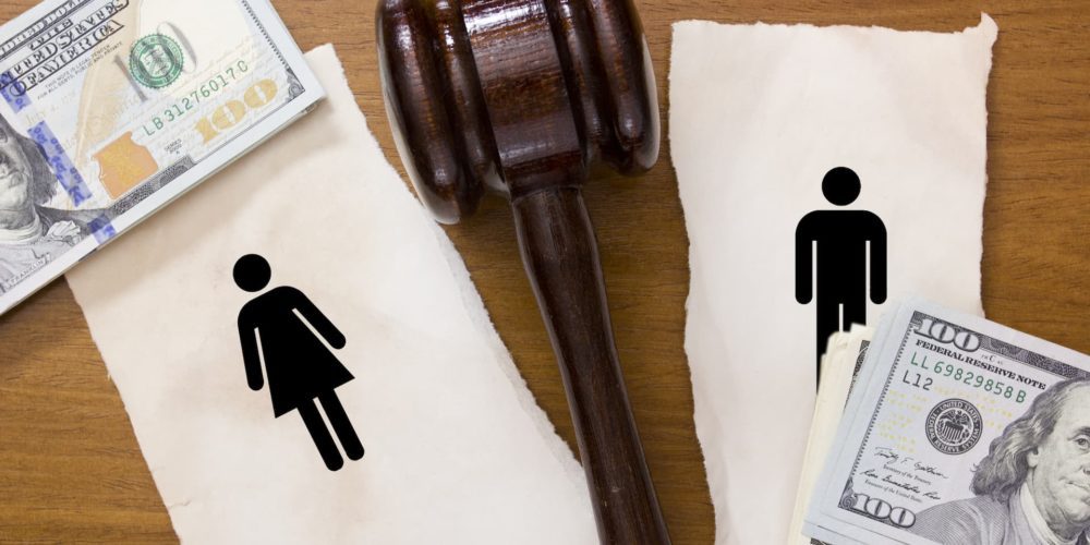 torn piece of paper with a gavel in between the pieces